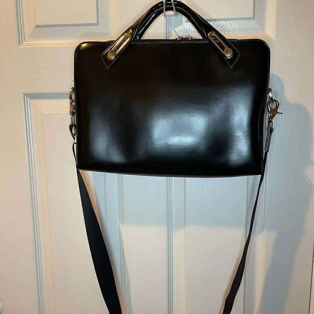Abbi New York Laptop/Briefcase Carrier Black leather inside padded fabric.